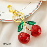 Lovely Red Cherry Bag Pendant with Twin Green Leaves, soft warm charm to brighten your everyday handbag styling In Australia - Darrahopens