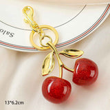 Elegant Red Cherry Bag Charm with double golden leaves, holding lovely little luck to accompany your trips out In Australia - Darrahopens