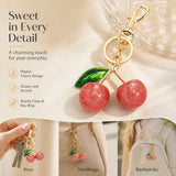 Petite Pink Cherry Keyring matched with a single green leaf, wrapping you in mild, quiet happiness each day In Australia - Darrahopens