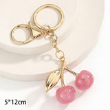 Tiny bubble pink cherry keyring decorated with golden leaves, creating light refreshing cheerful atmosphere all around In Australia - Darrahopens