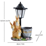 Solar Simulation Rabbit Ornament, charges by day and lights up automatically at night, three rabbits cluster around a street lamp with "WELCOME" bucket, warmly decorates courtyard and balcony, eco-friendly and healing./Rabbit's Kin