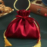 12PCS Red & Gold Drawstring Tassel Tote Bags – Exquisite & Festive, Perfect for Gift Wrapping and Holiday Decorations Alike.