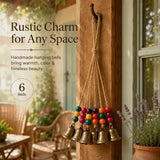 Handmade Bohemian Wind Chime, featuring jute rope with brass bells and colorful wooden beads, rings melodiously in the gentle breeze, adding natural romance to your home.