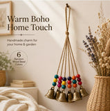 Handmade Bohemian Wind Chime, featuring jute rope with brass bells and colorful wooden beads, rings melodiously in the gentle breeze, adding natural romance to your home.