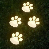 4PCS Dog Paw Solar Ground Light: Realistic paw print design, solar powered, auto on at night. Add warmth and charm to your garden pathway./white light