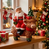 Santa Riding Highland Cow Resin Figurine | Hand-Painted Cute Design, Red Scarf & Mini Christmas Tree Accents, Festive Desktop Décor In Australia - Darrahopens