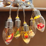 Christmas Wish Bulb String Light | 10 LED Warm Light Mini Scenes, Battery-Powered (Batteries Not Included), 150cm Long, Embedded Santa Claus, Snowman & Reindeer Designs, Hang Anywhere to Brighten Up the Holidays