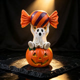 Halloween Resin Ghost Pumpkin Figurine: Little Ghost Sitting on Pumpkin with Candy on Head, Vintage Distressed Finish, Cute and Full of Character, Perfect for Desktops and Party Vibes.Ghost candy pumpkin-old style