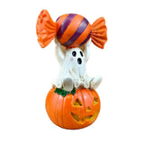 Halloween Resin Ghost Pumpkin Figurine: Little Ghost Sitting on Pumpkin with Candy on Head, Glossy Finish, Perfect Desktop and Party Decoration.