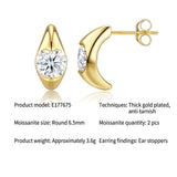 Elevate your everyday elegance with these luxurious moissanite drop earrings, featuring brilliant round-cut stones in a radiant gold setting. Designed for versatile wear, they effortlessly transition from chic daily office attire to refined formal occasio