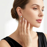 Elevate your everyday elegance with these luxurious moissanite drop earrings, featuring brilliant round-cut stones in a radiant gold setting. Designed for versatile wear, they effortlessly transition from chic daily office attire to refined formal occasio