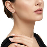Elevate your everyday elegance with these luxurious moissanite drop earrings, featuring brilliant round-cut stones in a radiant gold setting. Designed for versatile wear, they effortlessly transition from chic daily office attire to refined formal occasio