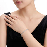Elevate your everyday elegance with a Square Moissanite Tennis Bracelet in Sterling Silver, featuring 38 brilliant-cut stones with unmatched fire and sparkle. Perfect for daily wear, formal events, and gifting, this luxury accessory combines durability wi
