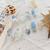 Blue seaside false nails, decorated false nails, seashell nail art, starfish nails, ocean-inspired nails, coastal nail designs, beach themed nails, Australian nail art