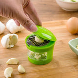 Kitchen Innovations Garlic Press, Crusher, Cutter, Mincer, and Storage Container - Includes Silicone Garlic Peeler - Easy to Clean
