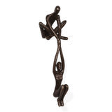 Contemporary Metal Shelf Décor - Bronze Sculpture - Man Lifting Woman from Ledge Handcrafted using the sand casting method