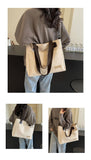 Stylish white canvas tote bag with detachable shoulder strap