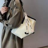 Chic Textured PU Leather Tote Bag with V-Cut Design & Decorative Ribbon Strap Accent(black)