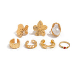 Darrahopens Fashion > Women's Fashion > Women's Accessories 7-Piece Molten Gold Tone Ring Set - Baroque Faux Pearl, Flower, Chain Link & Abstract Shield Bands - Ultimate Adjustable Boho Stackable Jewellery