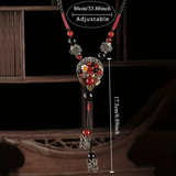 Darrahopens Fashion > Women's Fashion > Women's Accessories Bohemian style long necklace featuring retro beads and metal carved flowers with elegant dangling tassels adjustable 86cm chain suitable for pairing with sweaters and dresses perfect for daily wear or holiday occasions