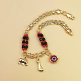 Darrahopens Fashion > Women's Fashion > Women's Accessories Gold-Tone Chain Bracelet with Red and Black Beads, Elephant Charm, Feather Pendant, and Round Stone Accent – 19 cm Length