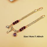 Darrahopens Fashion > Women's Fashion > Women's Accessories Gold-Tone Chain Bracelet with Red and Black Beads, Elephant Charm, Feather Pendant, and Round Stone Accent – 19 cm Length