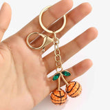 Darrahopens Gift & Novelty > Novelty > Novelty Gifts 2 Pcs Basketball shape design Creative Sports Ball Cherry Keychain – Cute Resin Charm for Car Keys, Bags & Backpacks