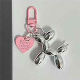 Darrahopens Gift & Novelty > Novelty > Novelty Gifts 2-Piece Silver Balloon Dog Keychain Set with Heart Charm Bag Pendant Cute Couple Gift(Pink button)