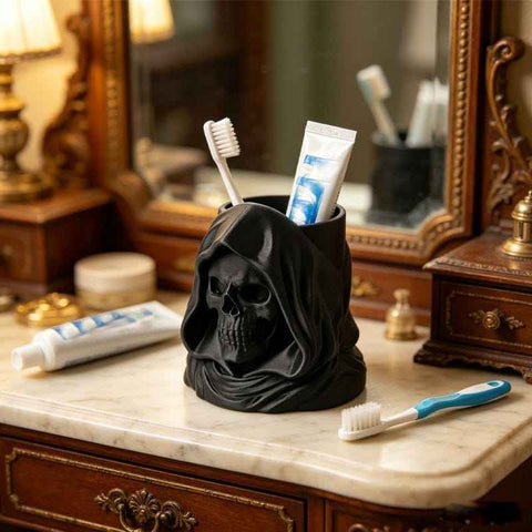 3D-printed hooded skull organizer, perfect for storing toothbrushes and toothpaste in your bathroom. Black.