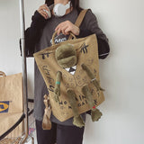 Darrahopens Home & Garden > Travel > Backpacks Khaki 3D Frog Graffiti Canvas Backpack Large Capacity 37x40cm School Bag for Students and Uni Students - Creative Aesthetic Rucksack